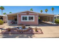 Charming home featuring covered parking and a well-maintained desert-style landscaped front yard at 9302 E Broadway Rd # 122, Mesa, AZ 85208