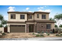 Charming two-story home with a stone facade and well-manicured desert landscaping at 1343 E Plum St, Gilbert, AZ 85298