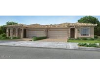 Charming, single story home boasting a tile roof, two car garage, neutral tones and mature landscaping at 17387 W Whispering Wind Rd, Surprise, AZ 85387