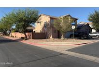 Two story home featuring a light brown stucco exterior, terracotta roof, and two car garage at 9904 E Elena Ave, Mesa, AZ 85208