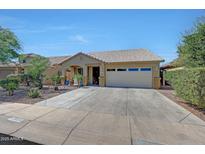 Charming single-story home with a well-maintained front yard and spacious driveway at 9926 W Gross Ave, Tolleson, AZ 85353