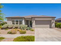 Charming single-story home featuring a well-maintained landscape and a neutral color scheme at 10240 E Supernova Dr, Mesa, AZ 85212