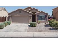 Charming single-story home with a well-manicured lawn and inviting curb appeal at 10618 W Pima St, Tolleson, AZ 85353