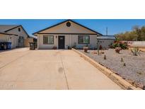 Charming single-story home with a desert landscape front yard and a spacious driveway at 4001 E Apollo Rd, Phoenix, AZ 85042