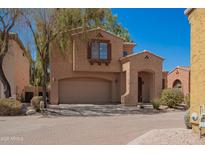 Charming two-story home with an attached two-car garage and covered entryway at 3041 E Fremont Rd, Phoenix, AZ 85042