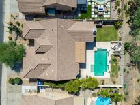 Expansive property showcasing a sparkling pool, lush green lawn and meticulously designed landscaping at 4010 E Hamblin Dr, Phoenix, AZ 85050
