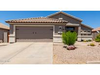 Charming single-story home with a well-manicured front yard and attached two-car garage at 10342 E Obispo Ave, Mesa, AZ 85212