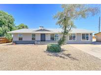 Charming single-story home featuring a xeriscaped front yard and a well-maintained exterior at 1716 W Villa Theresa Dr, Phoenix, AZ 85023