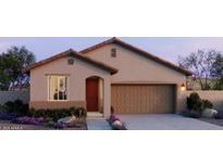Charming single-story home with a well-manicured front yard and a two-car garage at 5609 S 253Rd Ave, Buckeye, AZ 85326