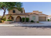 Stunning two-story home featuring a terracotta tile roof, arched entryway and a two car garage at 16178 W Granada Rd, Goodyear, AZ 85395