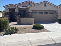 Charming single-story home with desert landscaping and a two-car garage at 16727 S 178Th Dr, Goodyear, AZ 85338