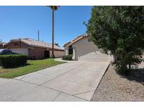 A charming single-story home with a two-car garage and well-maintained landscaping at 3897 E Douglas Loop, Gilbert, AZ 85234