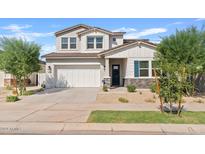 Charming two-story home with a well-manicured front yard and a two-car garage at 5650 S Feliz --, Mesa, AZ 85212