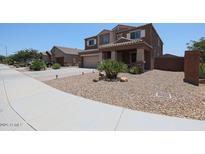 A charming two-story home featuring low-maintenance landscaping and an attached two-car garage at 9337 W Medlock Dr, Glendale, AZ 85305