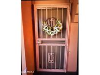 Stylish security door with decorative wreath for welcoming curb appeal at 12212 N Paradise Village S Pkwy # 439, Phoenix, AZ 85032