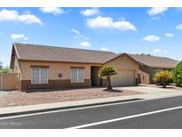 Charming single-story home with a well-maintained yard and inviting curb appeal, perfect for comfortable living at 14821 W Honeysuckle Ln, Surprise, AZ 85374