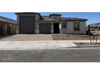 Charming single-story home featuring a low-maintenance front yard and a two-car garage at 16547 W Avenida Del Sol --, Surprise, AZ 85387