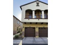 Inviting two-story townhome with a private balcony, beautiful stonework, and two-car garage at 2725 E Mine Creek Rd # 2146, Phoenix, AZ 85024