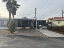 Charming home featuring a covered porch and drought-tolerant landscaping, perfect for low-maintenance living at 5933 E Main St # 1, Mesa, AZ 85206