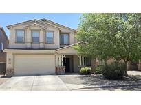 Charming two-story home with a two-car garage and welcoming front porch at 1075 E Crimm Rd, San Tan Valley, AZ 85143
