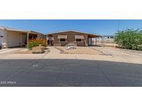 Cozy single story home with awnings and a covered carport is move-in ready at 11275 N 99Th Ave # 1, Peoria, AZ 85345