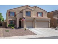 Two-story home featuring a tile roof, attached two-car garage, and a welcoming front yard with desert landscaping at 11832 W Electra Ln, Sun City, AZ 85373