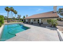 Inviting pool area with a spacious patio, perfect for outdoor relaxation and entertaining guests in a backyard oasis at 12222 N 74Th St, Scottsdale, AZ 85260