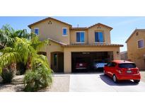 Inviting two-story home featuring a two car garage and manicured lawn at 1309 W Park St, Phoenix, AZ 85041