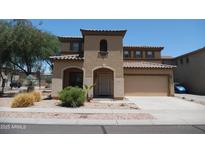 Two-story home featuring a tile roof, a neutral color scheme, and a two-car garage at 18548 W Sunbelt Dr, Surprise, AZ 85374