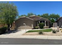 Charming single-story home with a well-maintained lawn and attached two-car garage at 4632 E Melinda Ln, Phoenix, AZ 85050