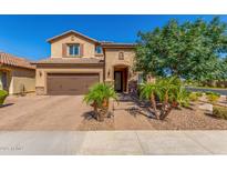 Charming two-story home with a well-manicured front yard and attached two car garage at 5235 S Dante --, Mesa, AZ 85212