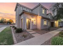 Beautiful two-story home featuring a welcoming entrance and well-maintained landscaping against a vibrant sunset backdrop at 8468 W Lewis Ave, Phoenix, AZ 85037