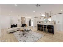 Bright, open-concept living room featuring a modern kitchen and stylish decor at 126 E Northern Ave, Phoenix, AZ 85020