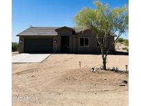 Charming single-story home featuring desert landscaping and a two-car garage at 13819 E Cavalry Dr, Scottsdale, AZ 85262