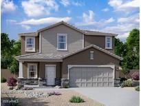 Charming two-story home with stone accents and a two-car garage at 15506 W Deanne Dr, Waddell, AZ 85355