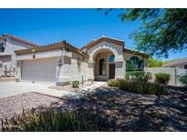 Charming single-Gathering home featuring a two-car garage and a well-maintained front yard at 20443 N 39Th Dr, Glendale, AZ 85308