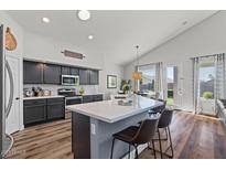 Bright kitchen boasts sleek countertops, modern appliances, and an island with seating at 3123 E Buena Vista Dr, Chandler, AZ 85249