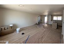 Large living room featuring lots of sunlight and new floors that are ready for final touches and customization at 3725 E Karen Dr, Phoenix, AZ 85032