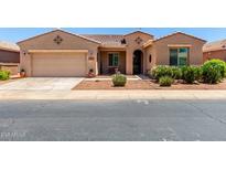 Charming single-story home featuring a two-car garage and well-maintained desert landscaping at 42709 W King Fisher Dr, Maricopa, AZ 85138