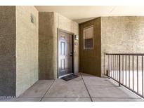 Inviting condo entrance featuring a secure front door and convenient outdoor access at 5303 N 7Th St # 326, Phoenix, AZ 85014