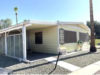 Charming single-story home with a covered entrance and well-maintained gravel landscaping at 120 N Val Vista Dr # 196, Mesa, AZ 85213