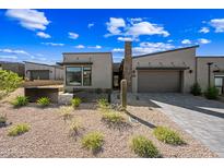 Charming single-story home featuring desert landscaping, stone accents, and a private gated entrance at 12746 E Casitas Del Rio E Dr, Scottsdale, AZ 85255