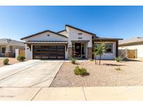 Charming single-story home featuring a modern garage door, low-maintenance landscaping, and neutral color palette at 1360 E Avenida Kino --, Casa Grande, AZ 85122