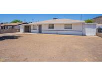 Charming single-story home featuring white paint and a simple, clean architectural design at 1526 W North Ln, Phoenix, AZ 85021