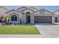 Charming single-story home featuring a low-maintenance yard, desert landscaping, and attached two-car garage at 16426 S 29Th St, Phoenix, AZ 85048