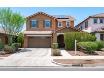 Inviting two-story home featuring a two-car garage and well-maintained landscaping at 2120 N Heritage St, Buckeye, AZ 85396