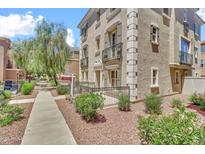 Elegant multi-story townhome with wrought iron balconies and desert landscaping at 2790 S Alpine Dr, Gilbert, AZ 85295