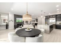 A lovely open-concept living space, featuring modern lighting and upscale finishes at 5250 E Deer Valley Dr # 146, Phoenix, AZ 85054