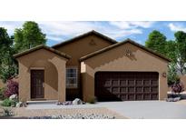 Charming single-story home featuring a two-car garage and low-maintenance desert landscaping at 5822 W Lodge Dr, Laveen, AZ 85339