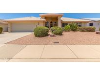 Charming single-story home with a well-maintained yard and a two-car garage at 7910 E Navarro Ave, Mesa, AZ 85209